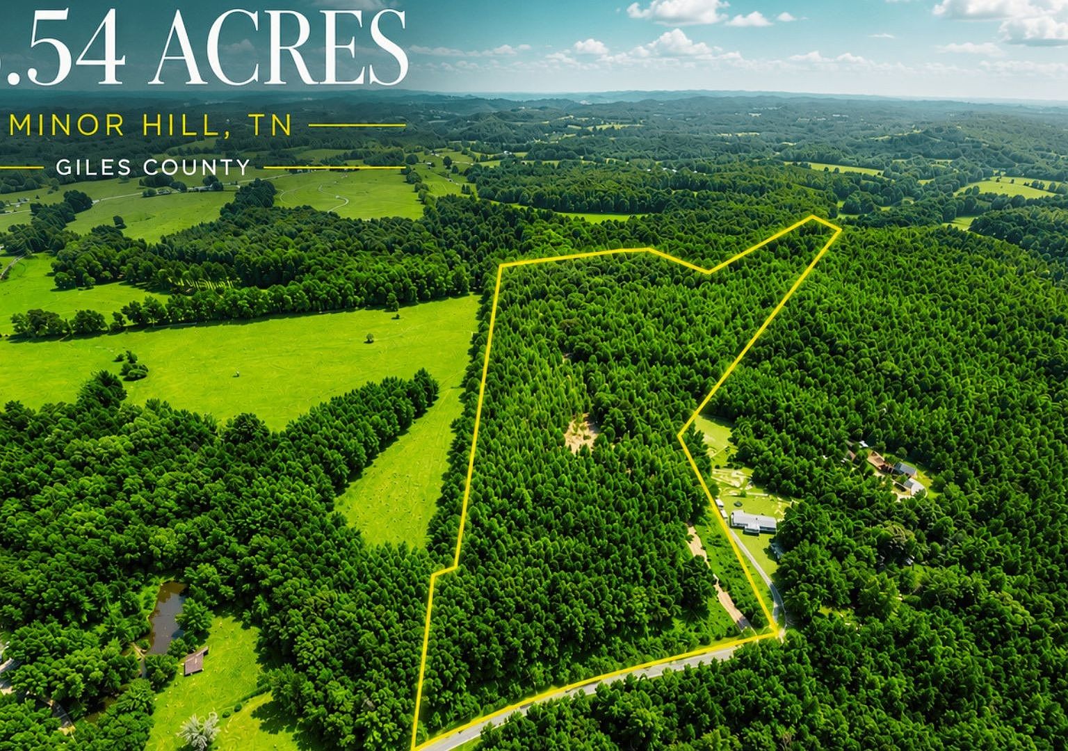Aerial view of a wooded property outlined in yellow, labeled 0.54 acres in Minor Hill, Tennessee, Giles County.
